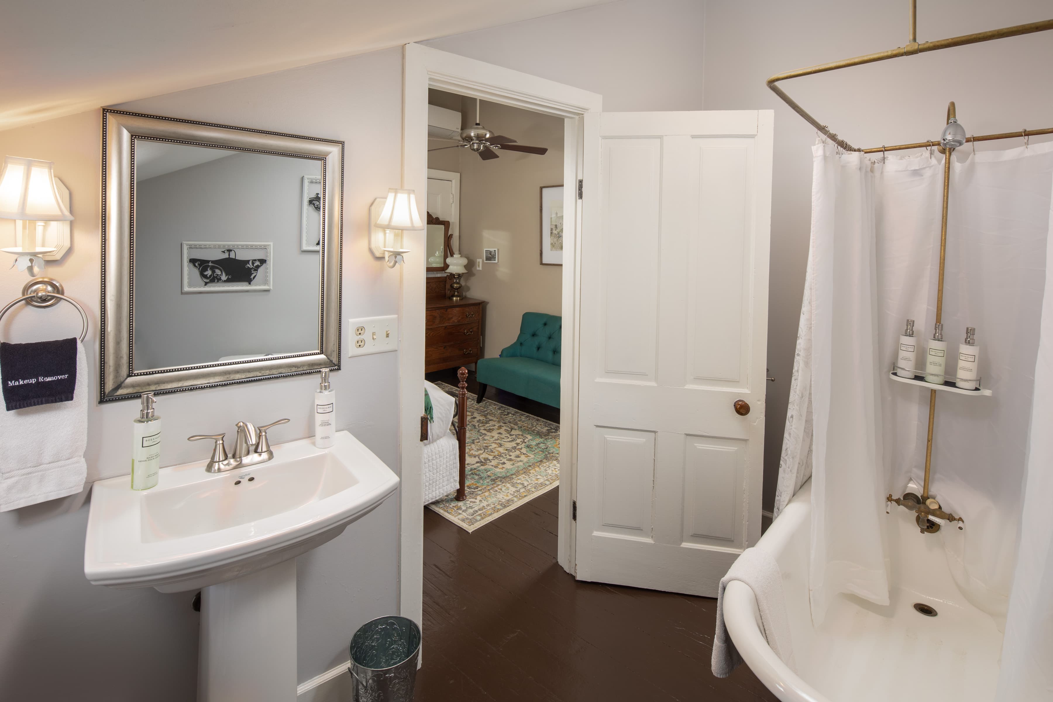 Private bath with claw foot tub & shower (this will be upgraded to a large walk-in shower this winter - 2026) and white pedestal sink