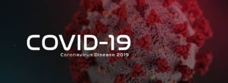 black background with red and pink spiky circular virus with the words COVID-19 Coronavirus Disease 2019 across the picture