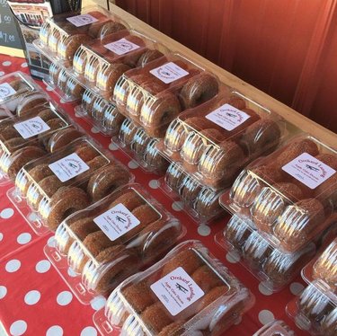 Packages of apple cider donuts displayed on a table