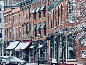 A row of historic shops on Galena, Illinois' Main Street covered in snow